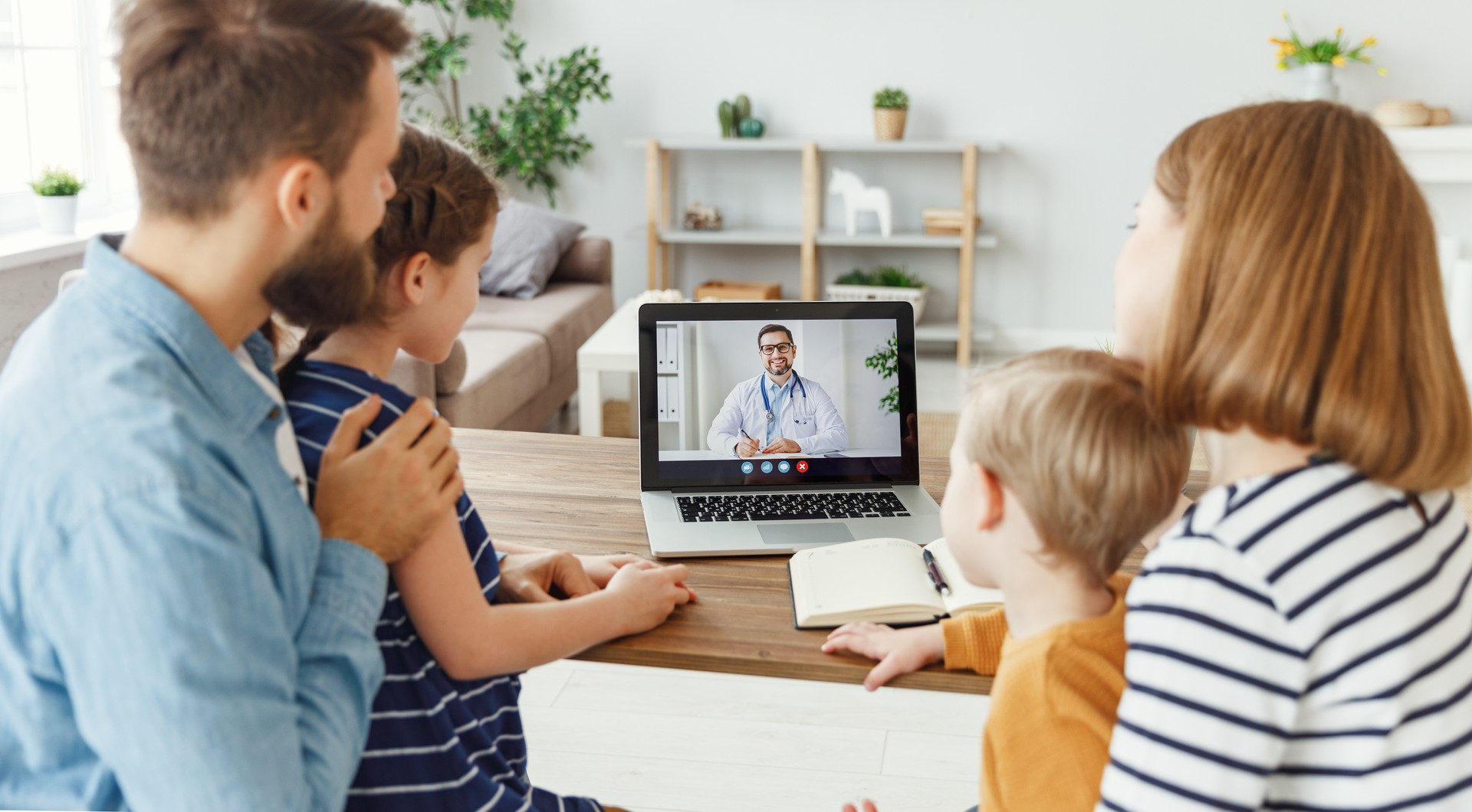 Family listening to online doctor