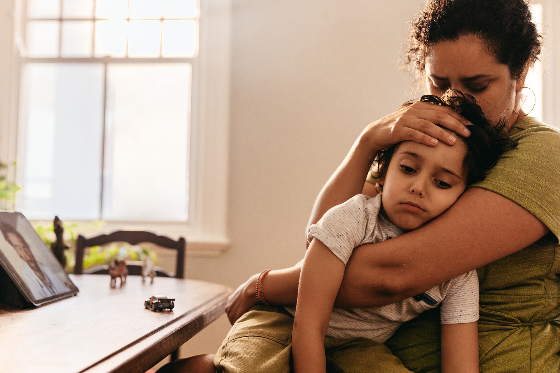 Compassionate mother caring for her sick son at home